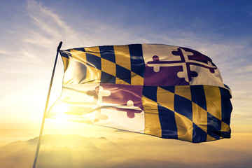 Maryland state of United States flag waving on the top sunrise mist fog