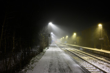 Trainstation in Winter with Snow and Fog