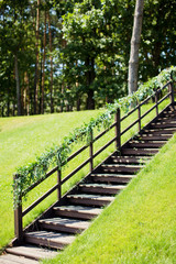 wooden stairs with garland of leaves