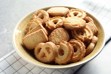 Bowl with Danish butter cookies on table, closeup