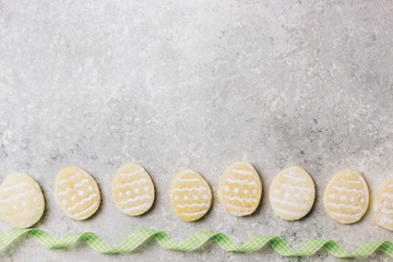 sugar easter cookies with colorful chocolate shape of eggs candy