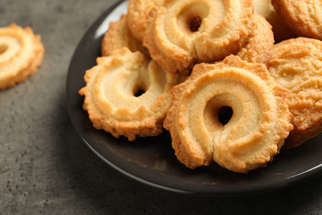 Plate with Danish butter cookies on table, closeup