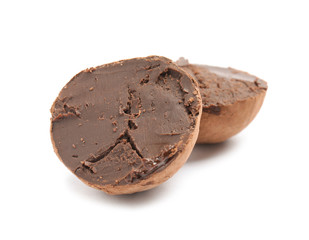 Delicious raw chocolate truffle on white background