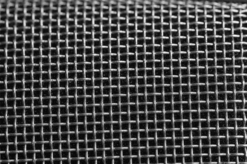 Metal mesh of microphone as background, closeup. Musical equipment