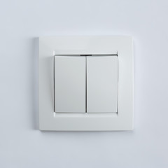 Light switch on white background. Electrician's equipment
