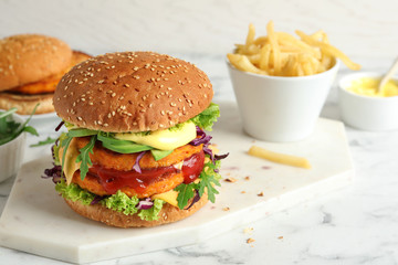Vegan burger with carrot patties served on table. Space for text