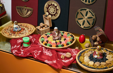 Novruz Azerbaijan traditional table with food tray, close-up.
