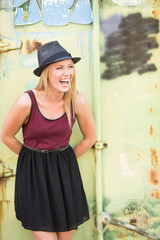 Playful model against boxcar