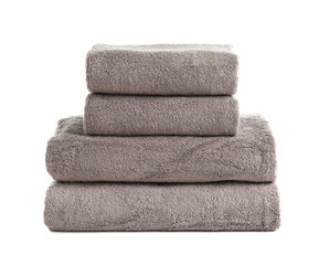 Stack of fresh towels isolated on white