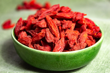 Healthy superfood, red dried goji chinese wolfberry berries, used in many snack foods and supplements, granola bars, yogurt, tea blends, fruit juice as whole berries or ground seeds, seed oil.