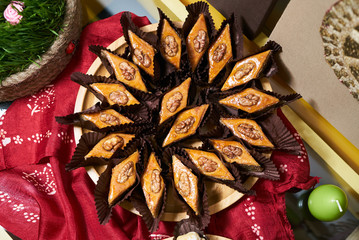 Novruz traditional Azerbaijan pastry pakhlava on wooden plate background