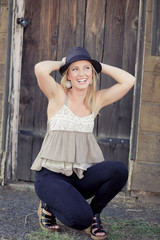 Cute young lady laughing with hat
