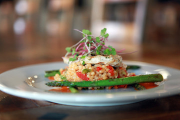 Gourmet Cuisine Couscous in restaurant with asparagus