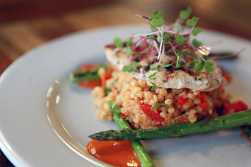 Gourmet Couscous meal Close Up with Asparagus in restaurant