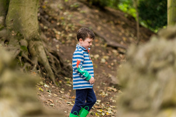 A small boy has an adventure through a forest