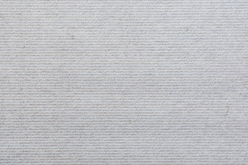 Full frame background of a light, almost white, carpet viewed from above.