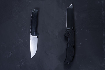 Two American knives. Fixed knife and folding knife.