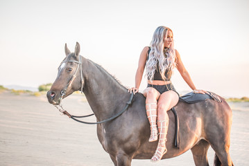 Fototapeta premium Arabian horse, a girl, and the desert
