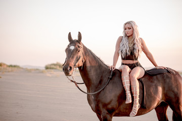 Fototapeta na wymiar Arabian horse, a girl, and the desert