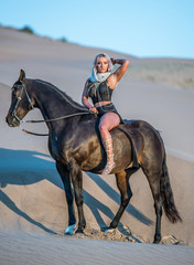 Arabian horse, a girl, and the desert