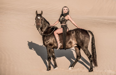 Arabian horse, a girl, and the desert