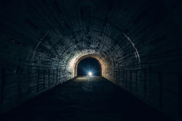 Underground concrete tunnel or corridor of abandoned nuclear bunker or shelter or basement with...
