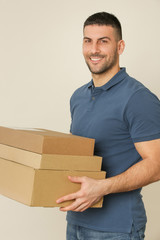 Young man holding cardboard box