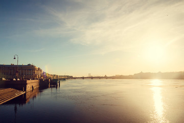 Fototapeta premium Neva spring at sunset. Center of St. Petersburg in the spring at sunset. Walk through the historic center of St. Petersburg. Spring sunset.