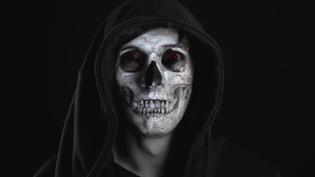 Demon in human form. The man's face turns into the face of a demon.