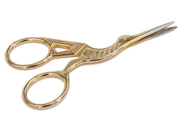 Scissors with curly handles in the shape of a bird, with clipping path, isolated on white background