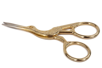 Scissors with curly handles in the shape of a bird, with clipping path, isolated on white background