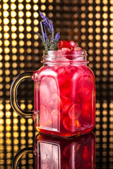 Red fruit cocktail lemonade in vintage jar