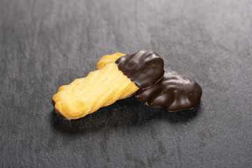 Group of two whole baked lazy cookie with chocolate on grey stone