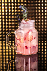 pink cocktail lemonade with fresh passion fruit in vintage jar