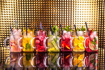 Multiple colorful cocktail lemonade with fresh fruits
