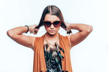 Young girl holding her hair in sunglasses