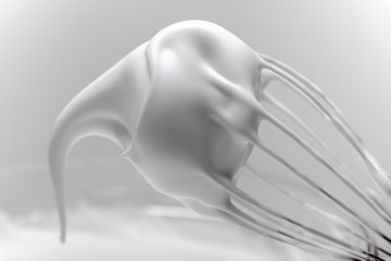 Metal whisk with whipped egg whites on white background