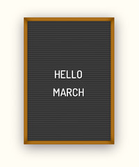 Hello March motivation quote on black letterboard black white plastic letters