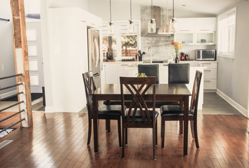 Fototapeta na wymiar elegant new modern home dining room and kitchen