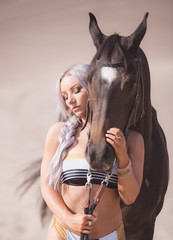 Fototapeta na wymiar Bikinis and Horses