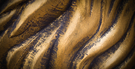 polished wavy bronze texture with vignette. background, concept