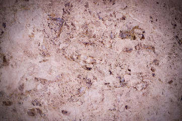 pink marble texture interspersed with quartz. vignette, background, geological.