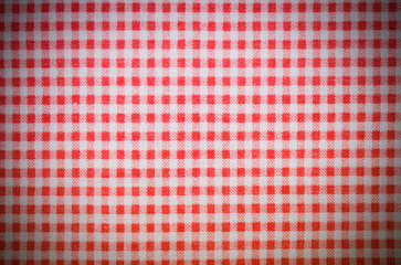 red textile checkered towel texture with vignette. background, kitchen.