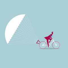 The bicycle is slowed down using a parachute. Isolated on blue background. - obrazy, fototapety, plakaty