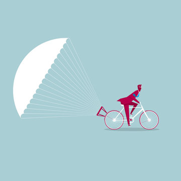 The bicycle is slowed down using a parachute. Isolated on blue background.