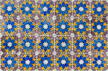 Ornate brightly colored portugese tile texture in blue, purple, olive and yellow