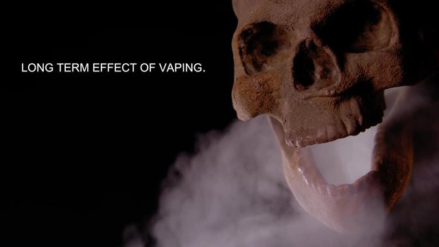 LONG TERM EFFECT OF VAPING.  HUMAN SKULL VAPES AS A MESSAGE APPEARS IN NEGATIVE SPACE.  SHOT IN 4K, 10 BIT, ALL-INTRA.