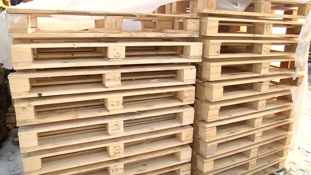 Stacks of wooden Europallets ready for use