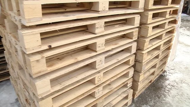 Stacks of wooden Europallets ready for use
