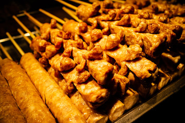 Closeup grilled sausage preparation on sale in the market